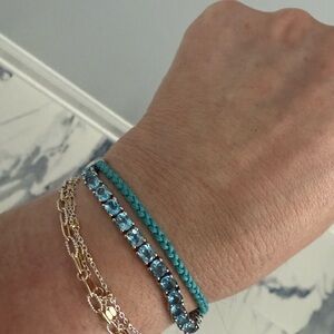 3.10 TW of genuine blue topaz set in 925 Sterling Silver Macrame cord